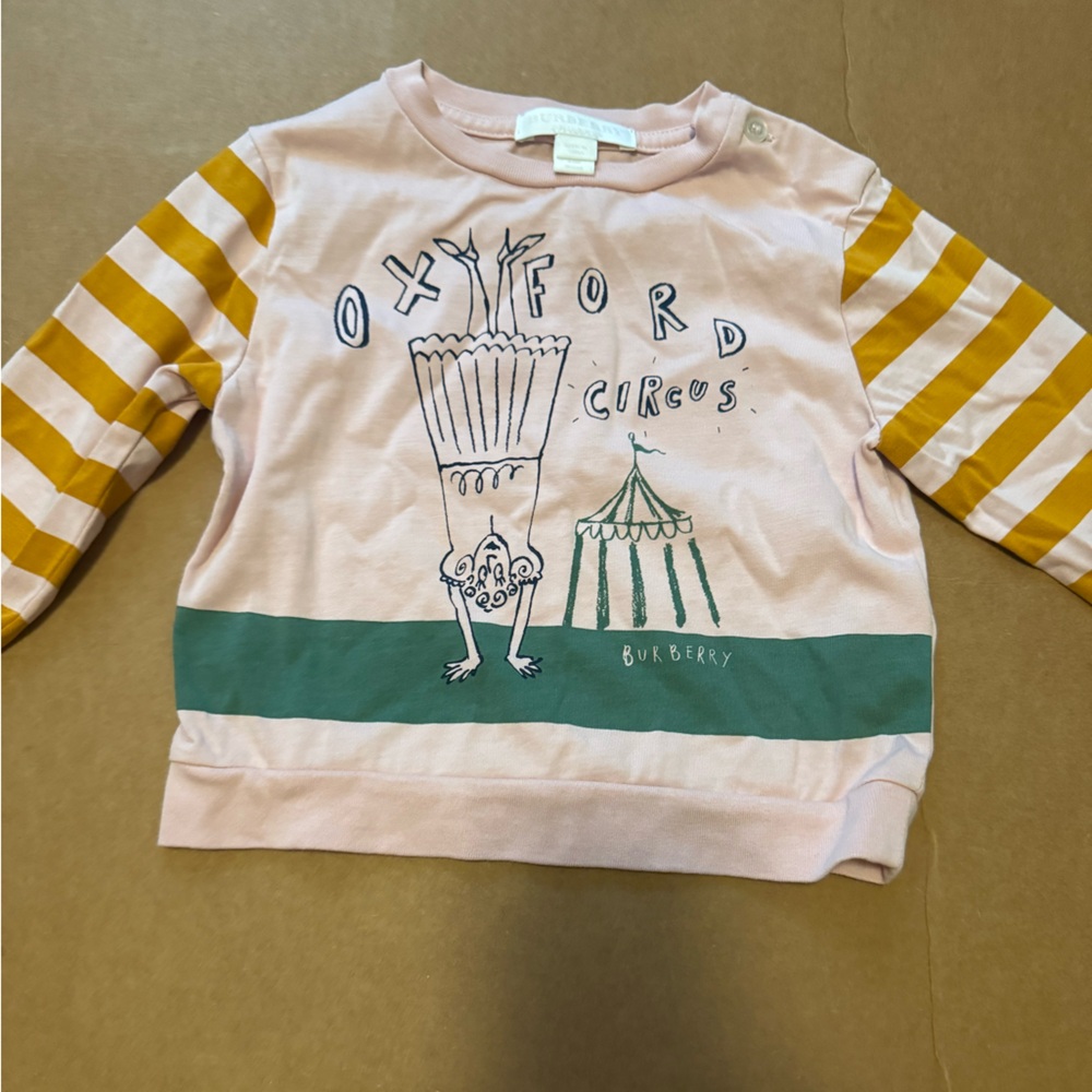 Burberry Light Pink Circus Graphic Shirt ( worn in good condition )